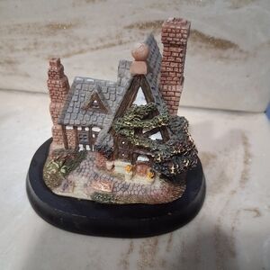 Charming Cottage Figurine with Black Base